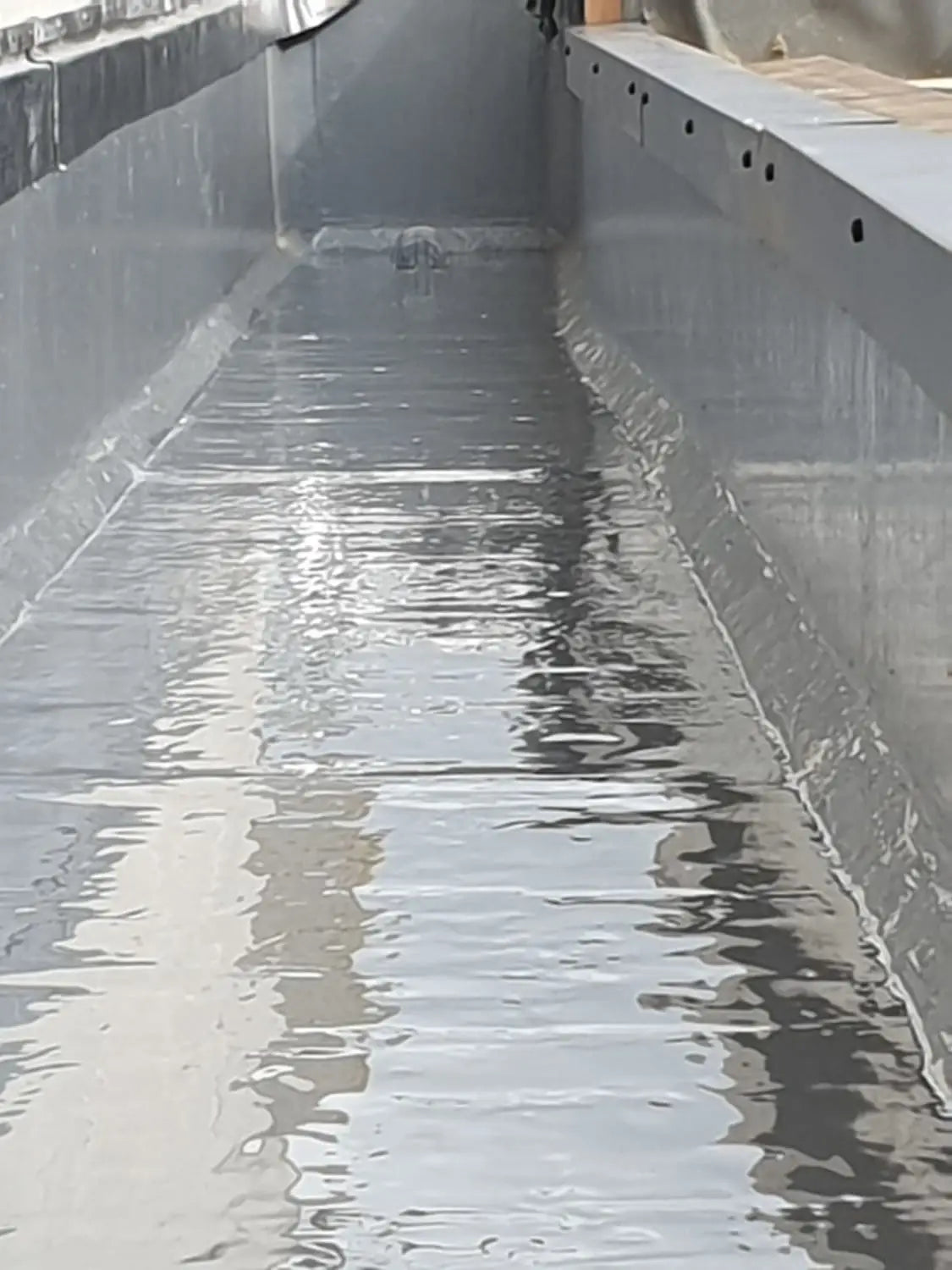 Polymer Liquid Waterproof Coating Application to a New University Building.