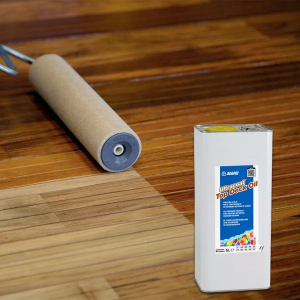 Ultracoat Top Deck Oil being applied to outdoor wooden decking with a roller – UV and mould protection for external timber surfaces