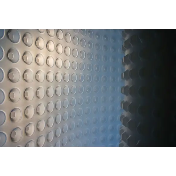 Perforated metal surface of Newton CDM 508 8mm Studded Membrane with circular indentations
