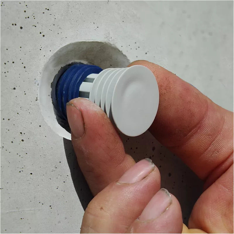 Water-swellable Sealing Plug for concrete spacers with impact-resistant core. Easy to install, pressure-resistant up to 6 bar. Sizes: 22–34mm.