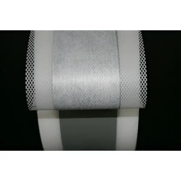 Roll of white medical tape with mesh edges for Aqua Build Fleece-backed product
