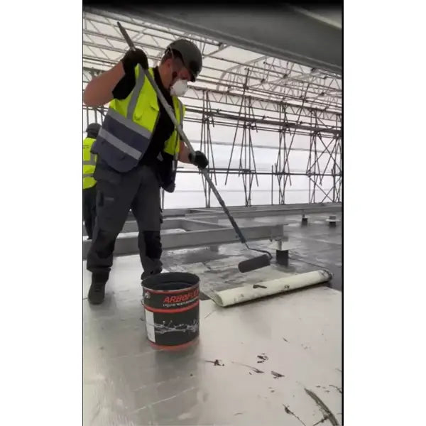 Construction worker applying sealant from Arboflex Roof Kit 4 for roof protection