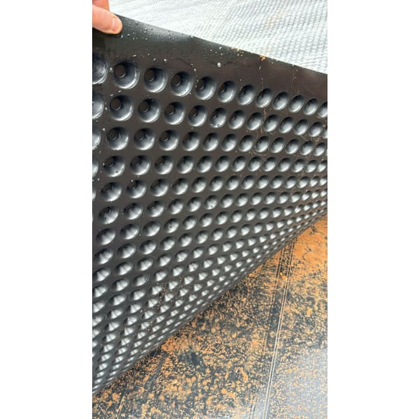 Black dimpled drainage mat featured in CleverShield CM20 Geotextile Membrane 2m x 10m