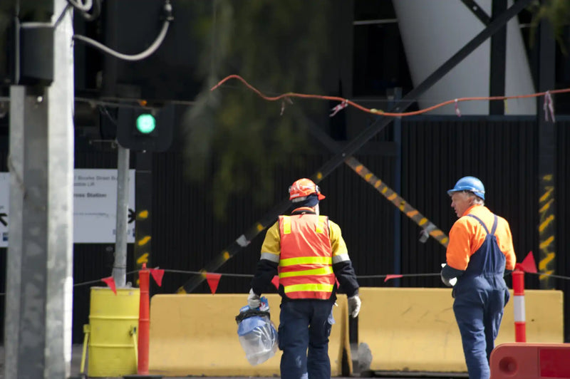 Construction workers in safety gear.