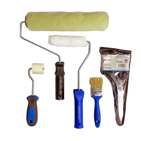 Paint rollers and brushes with blue handles in DIY Installation Kit for home projects