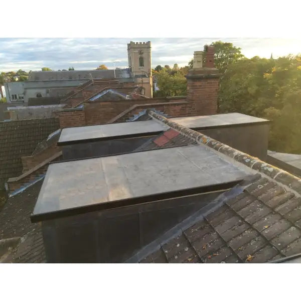 Rooftop skylights enhancing a tiled roof with Dormer Rubber Roof Kits