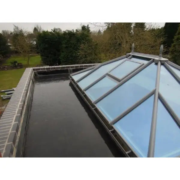 Glass-paneled conservatory roof in EPDM Orangery Roof Kits for elegant outdoor spaces