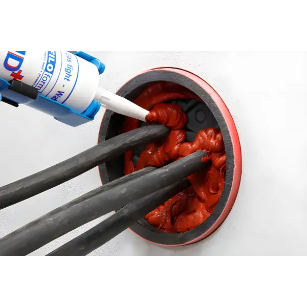 Electrical cables sealed with red Filoform Filoseal+HD Fire fire-stopping material
