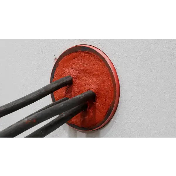 Chopsticks dipping into a bowl of bright red sauce showcasing Filoform Filoseal+HD Fire