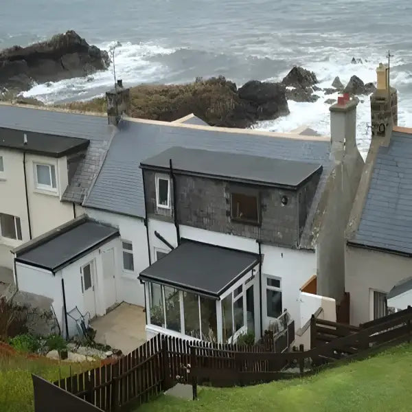 Coastal row houses featuring Flat Rubber Roof Kits for durable roofing solutions
