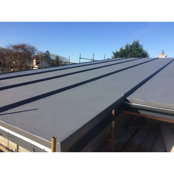 Gray metal standing seam roof showcasing Flexitec 2020 Resin in Grey color