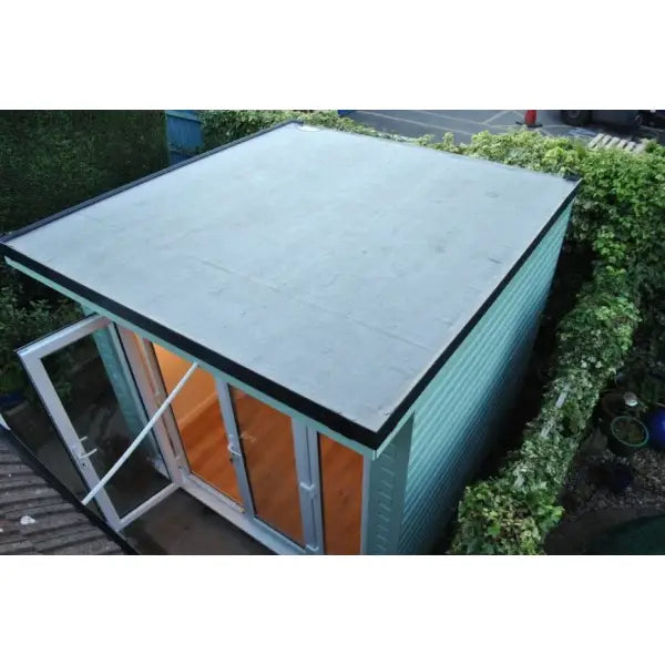 Flat-roofed garden room featuring Garden Room Roof Kits for versatile outdoor spaces