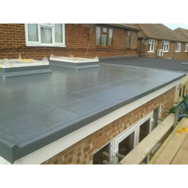 Flat gray rubber roof with skylights on a brick structure featuring GRP 450gsm Fibreglass Matting