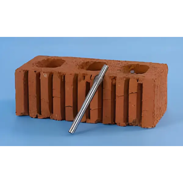 Red clay brick with grooves and holes beside Helical Fixing Tool Auto Key for easy installation