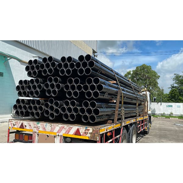 Truckload of black pipes for IPS Ceramic 1K product showcasing industrial supply