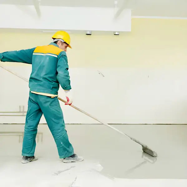 Construction worker smoothing concrete for QuickDeck Car Park Decking System installation