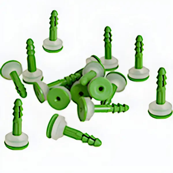 Green plastic screw-in wall anchors from Surefix Green CM Brick Plugs on a surface