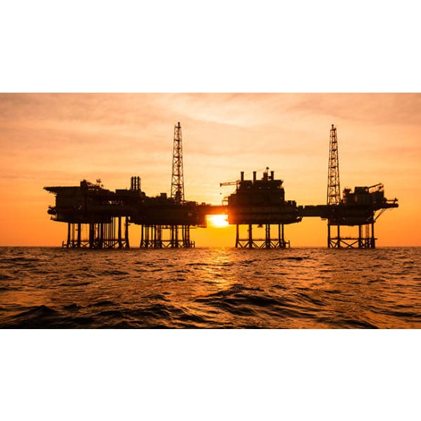 Offshore oil platform at sunset featuring Thermaguard SAL 600 for enhanced protection