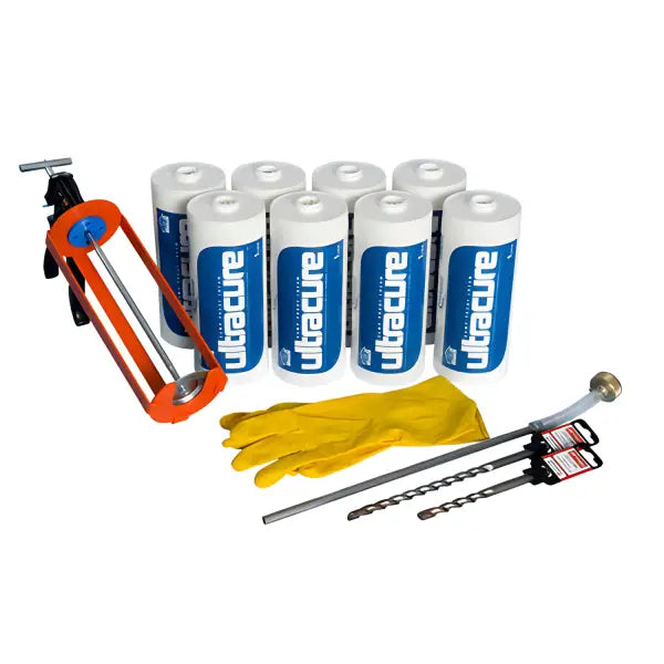 Blue batteries with drill bits, rubber gloves, and a carabiner for Ultracure Damp Proof Cream Kits