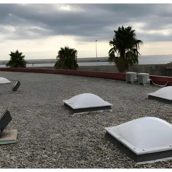 Skylights on a gravel rooftop enhanced by Ultraflex Liquid Waterproofing system