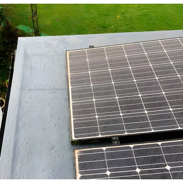 Solar panels on a gray surface for Ultraflex Liquid Waterproofing product display