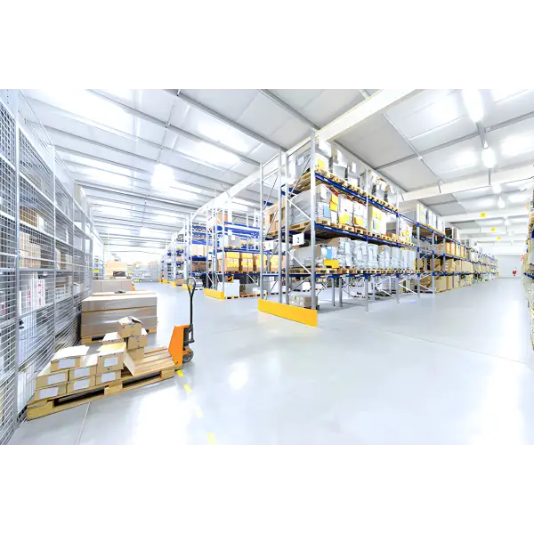 Modern warehouse with VIP QuickFloor featuring multi-level metal shelving and stacked boxes