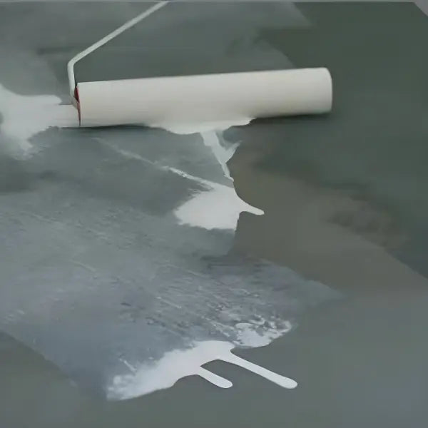 Paint roller applying white paint from Wykamol Microsealer Anti Lime to a surface